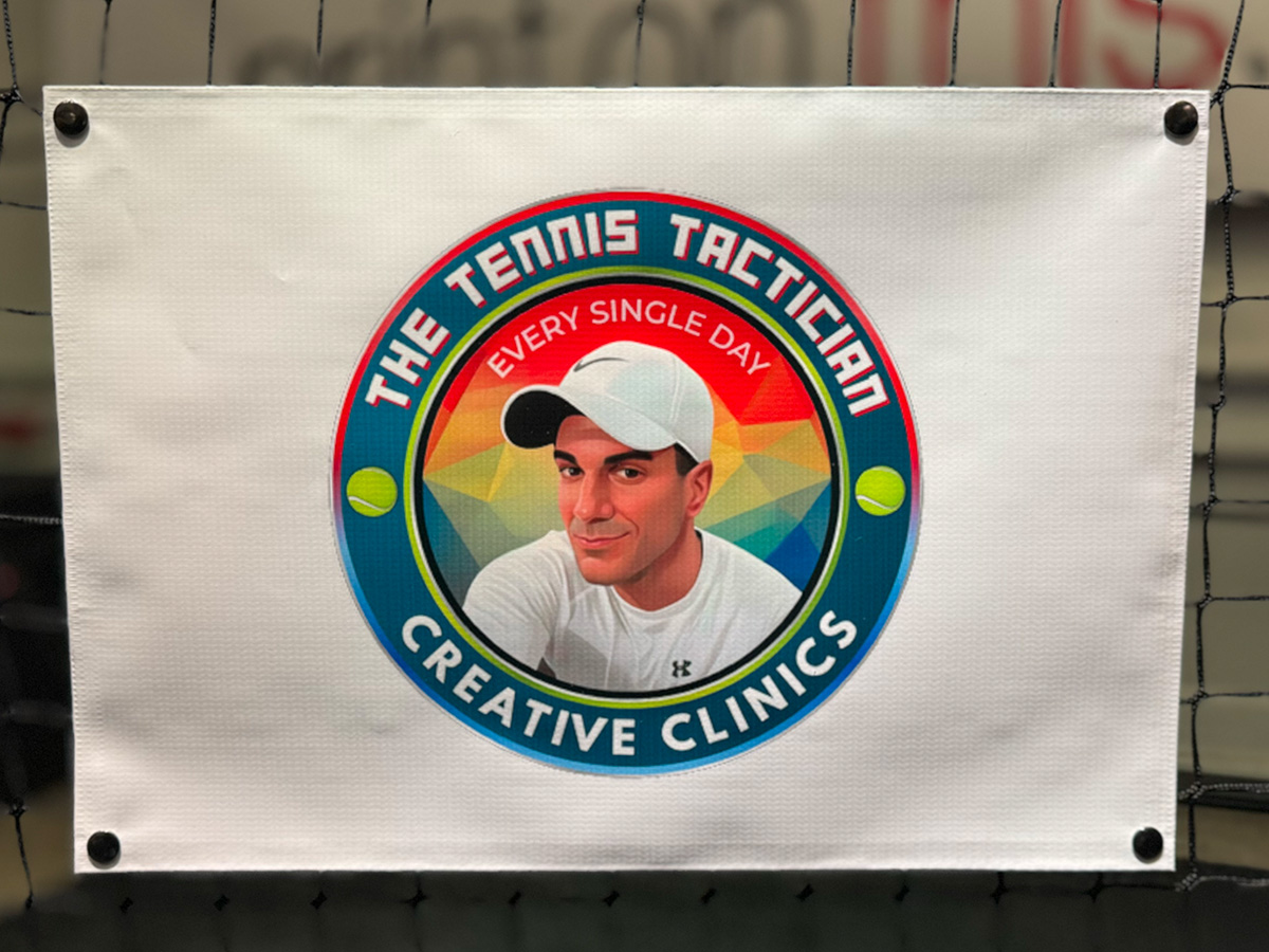 Tennis Tactician branded NetSnapz net banner on a practice court