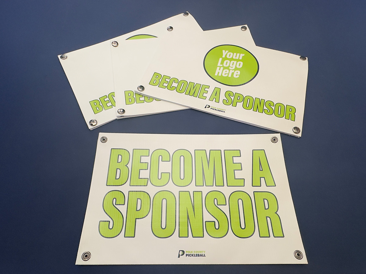 Become a Sponsor banner snapped onto a residential pickleball net